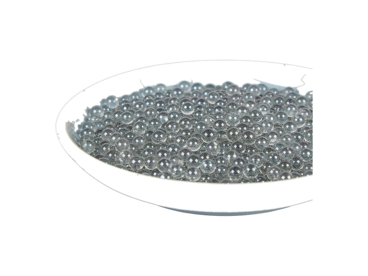 Dense small glass beads used as grinding and dispersion media, in a ceramic dish